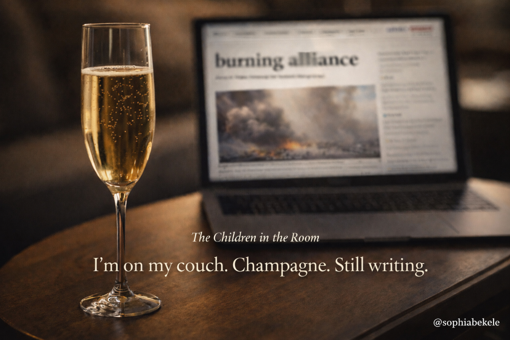 A glass of champagne on a coffee table with a laptop in the background, dim lighting. Text overlay reads burning alliance The Children in the Room I'm on my couch Champagne Still writing